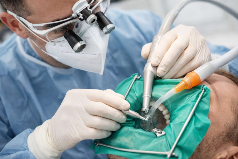 Dentist performing advanced dental treatment using modern dental equipment at White Diamond Dental Colorado Springs